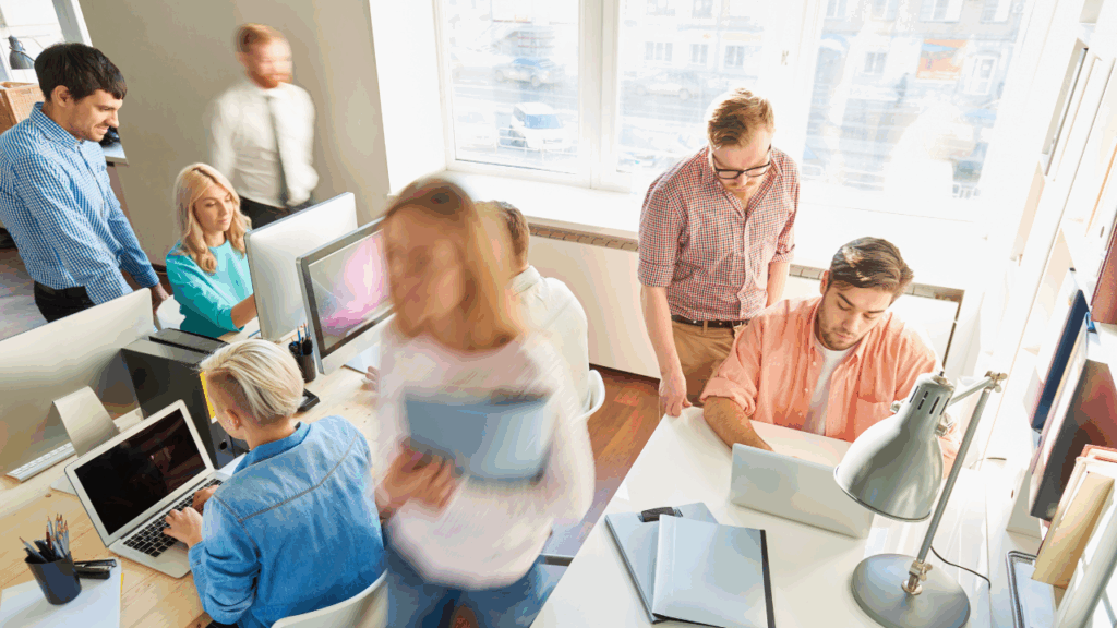 busy startup team working in office, unlocking team potential in startups